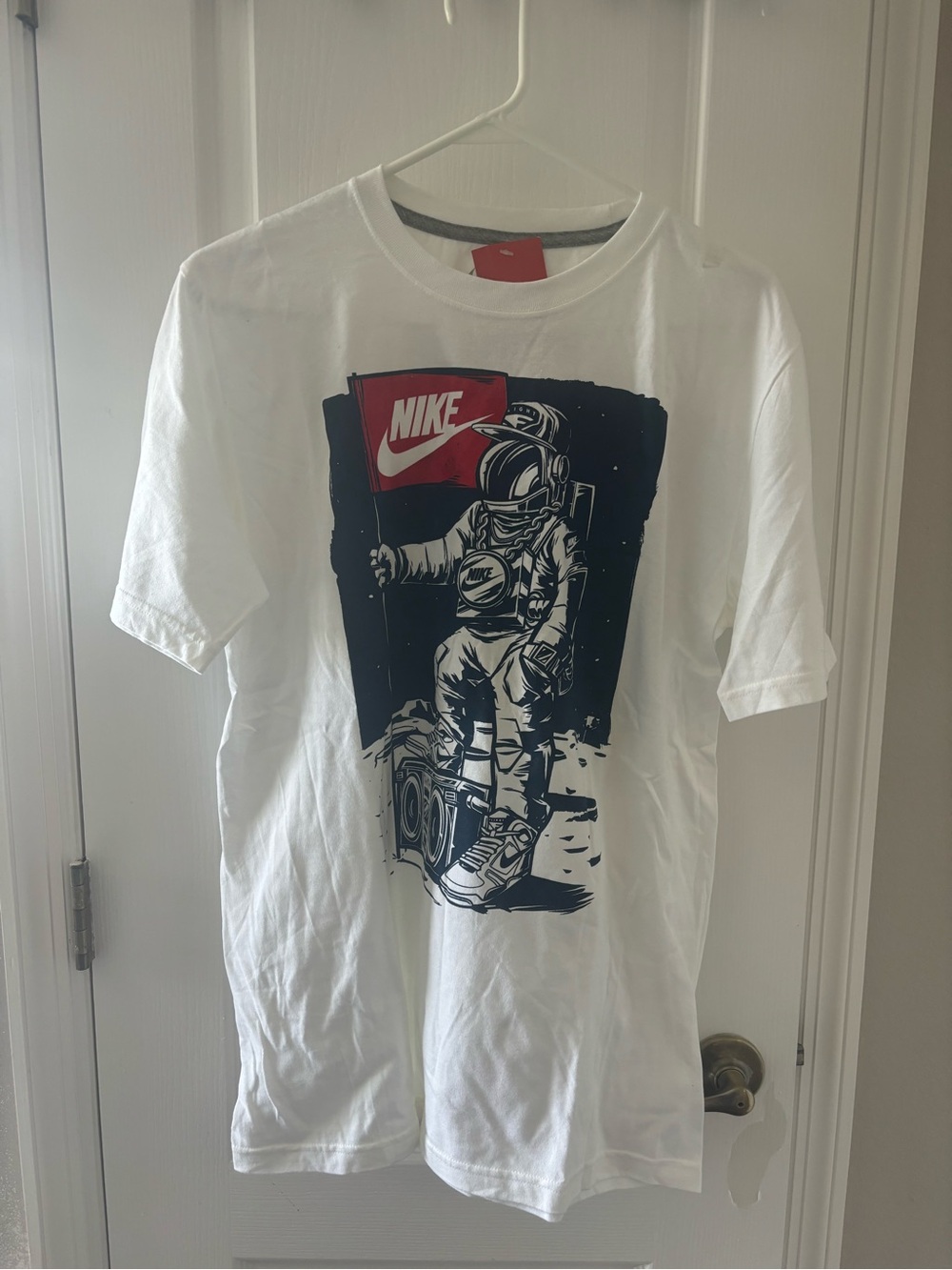 Nike White Short Sleeve Tee with Astronaut and Red Flag Graphic